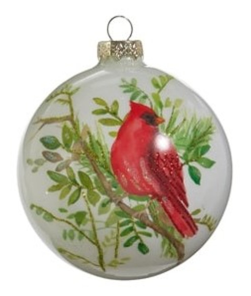 Ornement en forme de boule en verre. Cardinal sur une branche de pin.