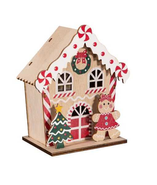 Maison en pain d'épice en bois, éclairée, avec une petite fille en pain d'épice