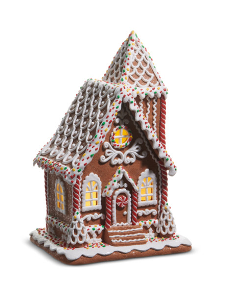 Maison en pain d'épice éclairée avec paillettes