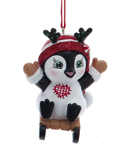 Ornement, pingouin festif sur traîneau