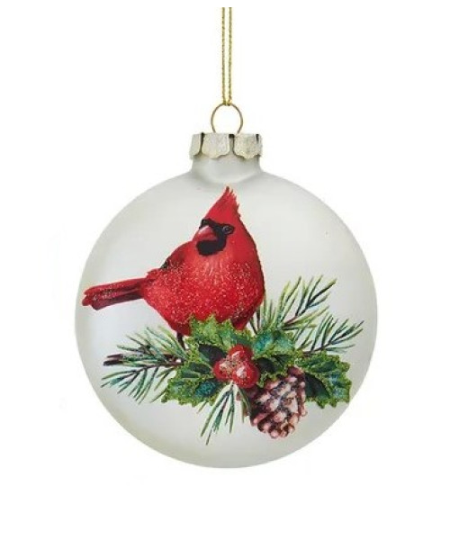 Ornement en verre en forme de balle plate, avec un cardinal, des feuilles de houx et une pomme de pin