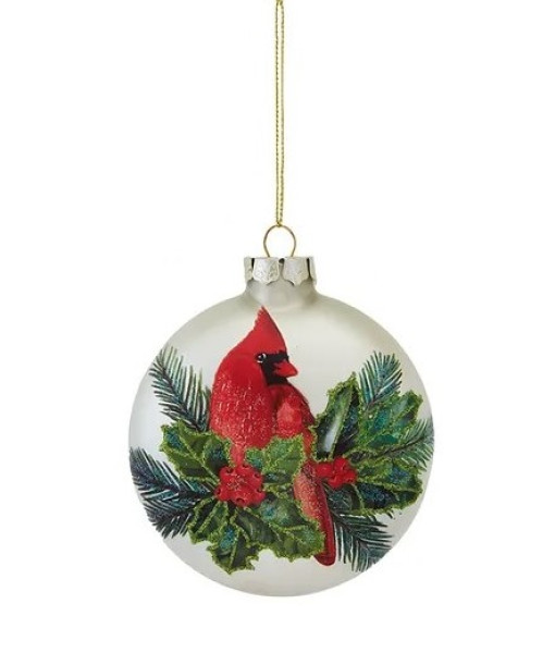 Ornement en verre en forme de balle plate, avec un cardinal, des feuilles de houx et une pomme de pin