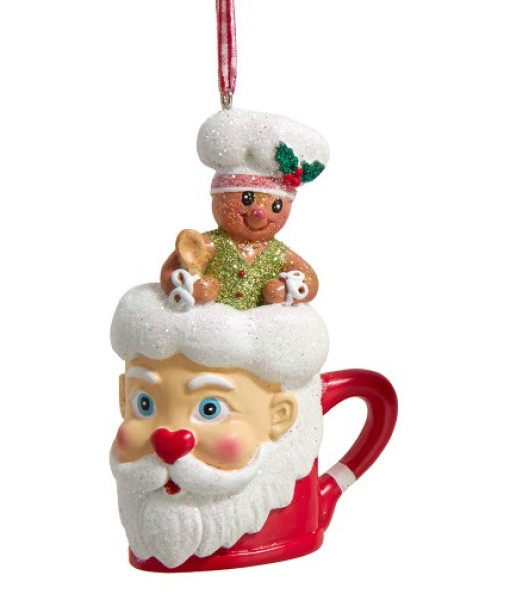 Ornement en résine, petit bonhomme en pain d'épice dans une tasse de Pere Noël