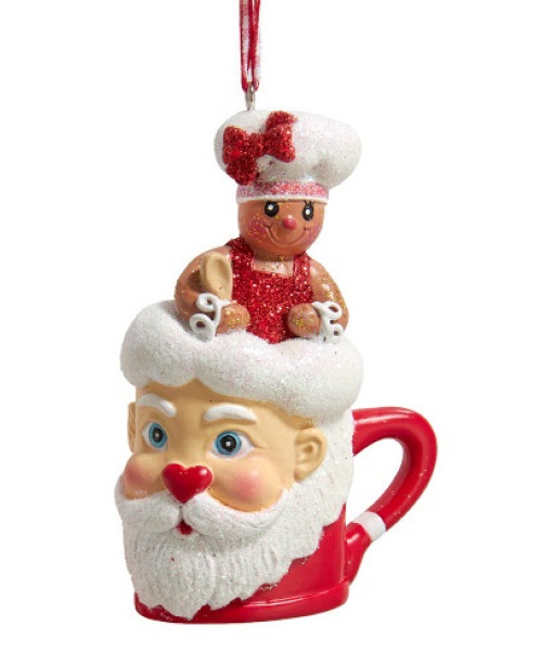 Ornement en résine, petite fille en pain d'épice dans une tasse de Père Noël