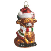 Ornement en verre, vache Highland avec un chapeau de Père Noël.