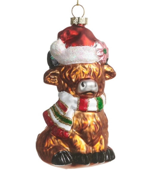Ornement en verre, vache Highland avec un chapeau de Père Noël.